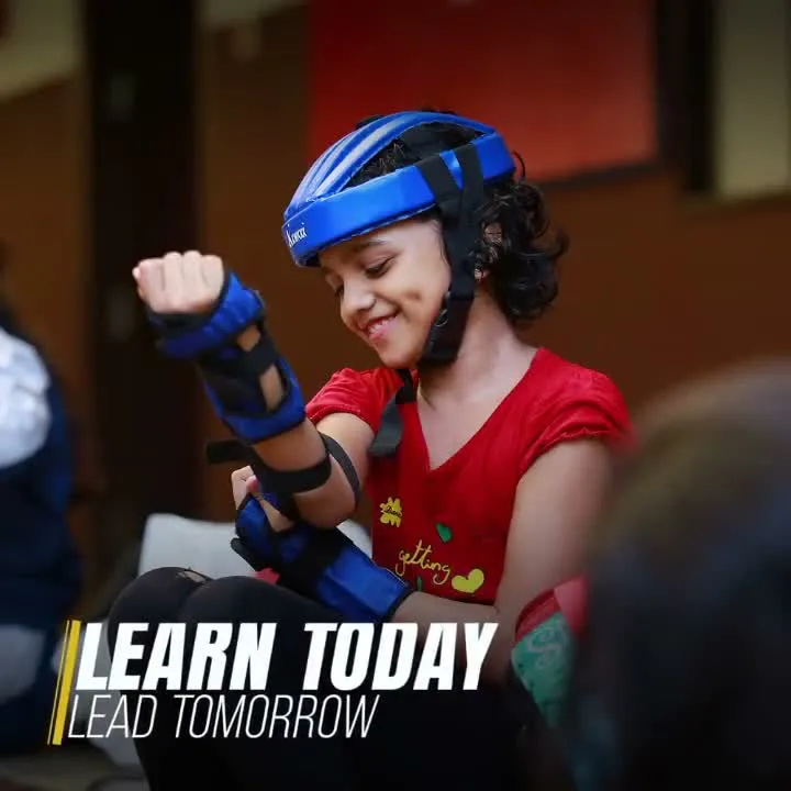 A pupil wearing a helmet and protective equipment in a skating video still